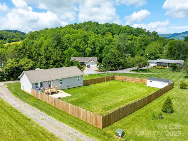 21 Brown Trout Trl, Candler, NC 28715 - aerial view of property and surrounding area featuring a heavily wooded area