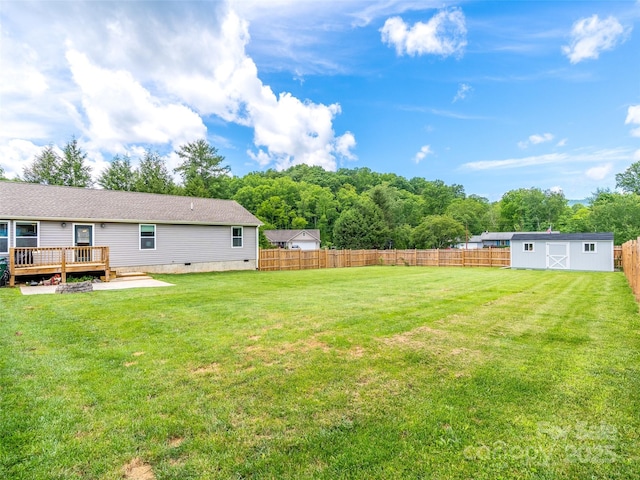 21 Brown Trout Trl, Candler, NC 28715 - fenced backyard with a deck and a shed