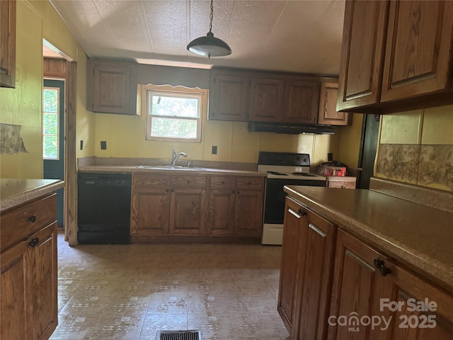 107 Round Pond Rd, Rutherfordton, NC 28139 - kitchen featuring dishwasher, white electric range, under cabinet range hood, pendant lighting, and brown cabinetry