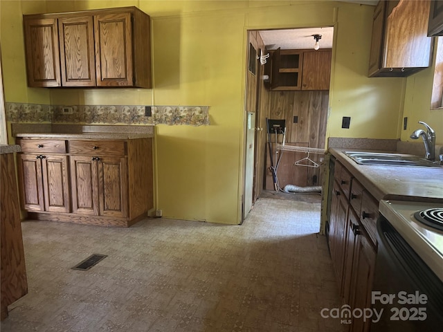 107 Round Pond Rd, Rutherfordton, NC 28139 - kitchen featuring brown cabinetry, range, and wood finished floors