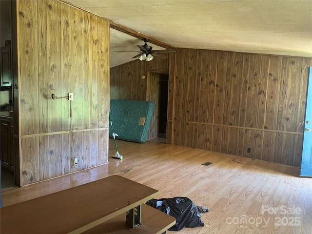 107 Round Pond Rd, Rutherfordton, NC 28139 - unfurnished room featuring wood walls, wood finished floors, ceiling fan, and lofted ceiling