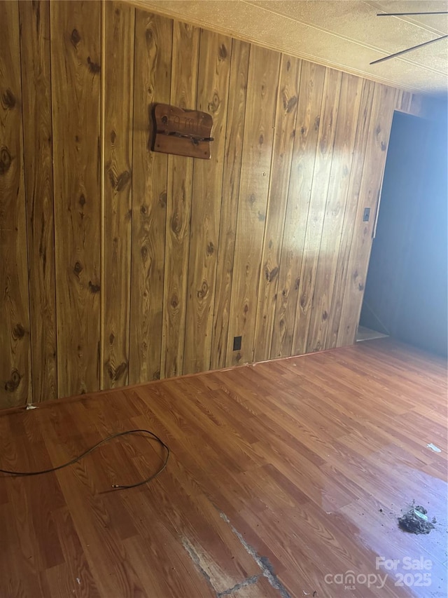 107 Round Pond Rd, Rutherfordton, NC 28139 - spare room with wood walls and wood finished floors