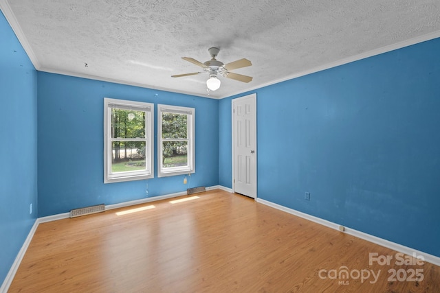 7011 S Providence Rd, Waxhaw, NC 28173 - empty room with wood finished floors, ceiling fan, a textured ceiling, and ornamental molding