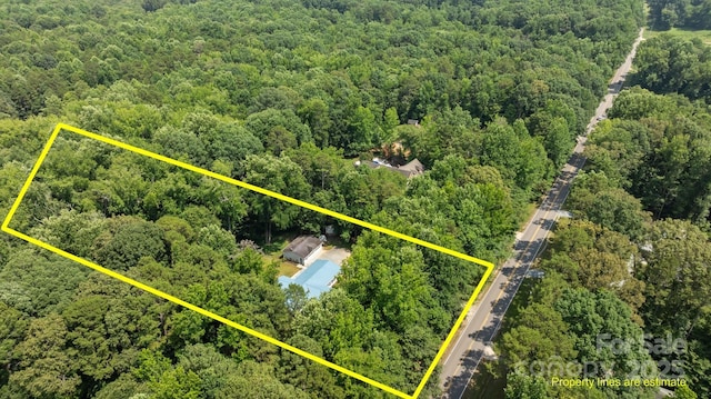 7011 S Providence Rd, Waxhaw, NC 28173 - aerial view of property and surrounding area with a forest and property parcel outlined