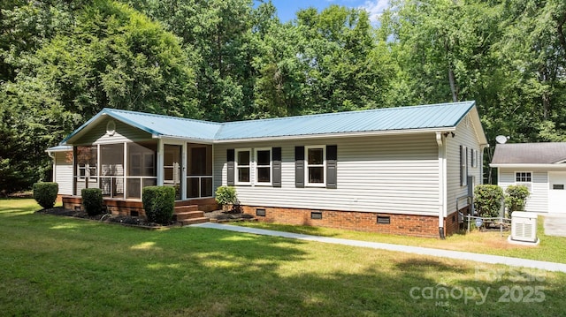 7011 S Providence Rd, Waxhaw, NC 28173 - view of front of home with crawl space, a sunroom, a front yard, a metal roof, and a garage