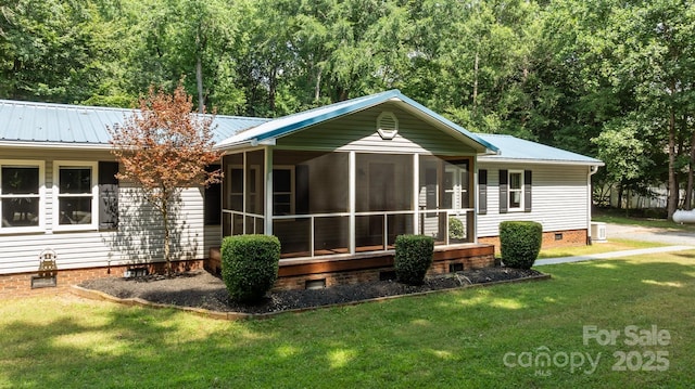 7011 S Providence Rd, Waxhaw, NC 28173 - back of property with crawl space, a sunroom, a yard, and a metal roof