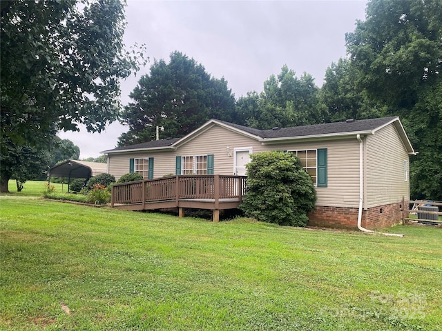 117 Haystack Ln, Olin, NC 28660 - back of house featuring a carport, a wooden deck, a yard, and crawl space