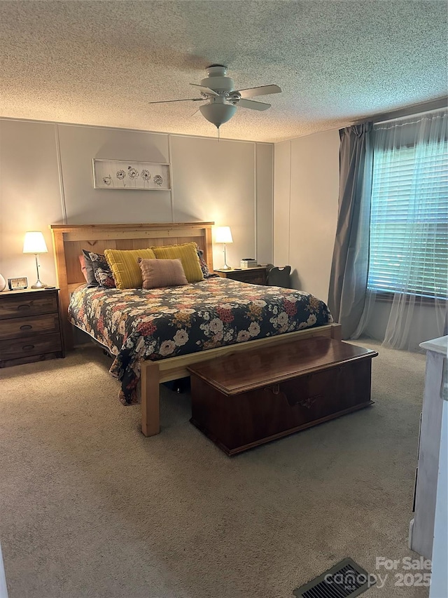 117 Haystack Ln, Olin, NC 28660 - carpeted bedroom with a textured ceiling and a ceiling fan