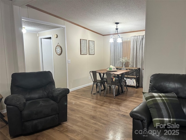 117 Haystack Ln, Olin, NC 28660 - dining space with ornamental molding, wood finished floors, and a textured ceiling