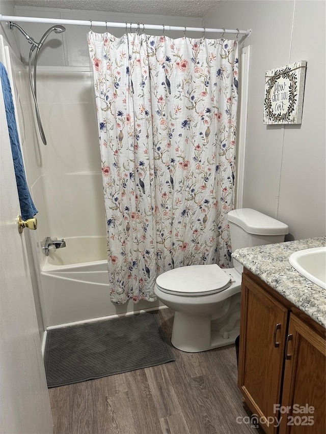 117 Haystack Ln, Olin, NC 28660 - full bathroom featuring wood finished floors, vanity, and shower / bath combo with shower curtain