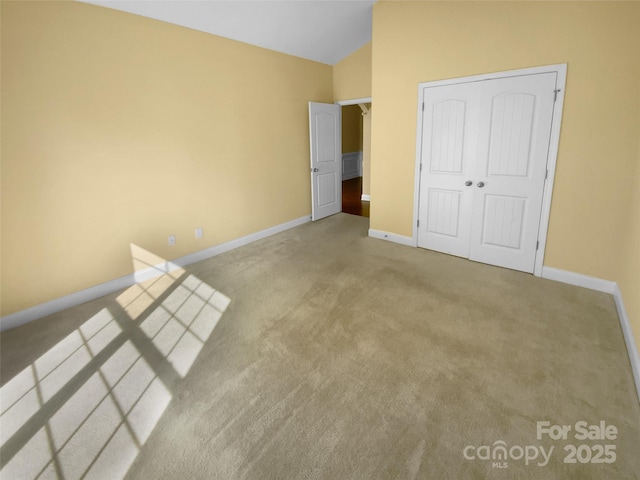 13419 Morgan Lee Ave, Charlotte, NC 28213 - unfurnished bedroom featuring carpet flooring, lofted ceiling, and a closet