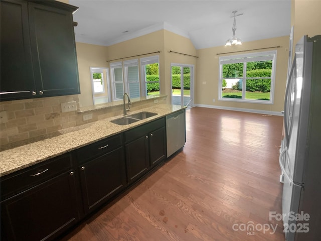 13419 Morgan Lee Ave, Charlotte, NC 28213 - kitchen featuring stainless steel appliances, plenty of natural light, wood finished floors, light stone countertops, and lofted ceiling