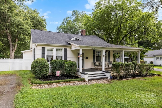 1210 Jackson Rd, Gastonia, NC 28052 - view of front of house with a porch, a chimney, a shingled roof, and driveway