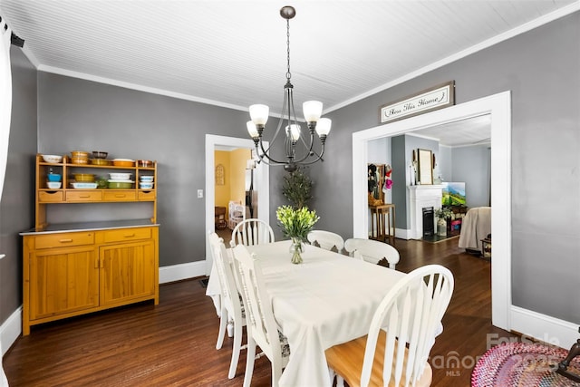 1210 Jackson Rd, Gastonia, NC 28052 - dining space with a chandelier, dark wood finished floors, ornamental molding, and a fireplace