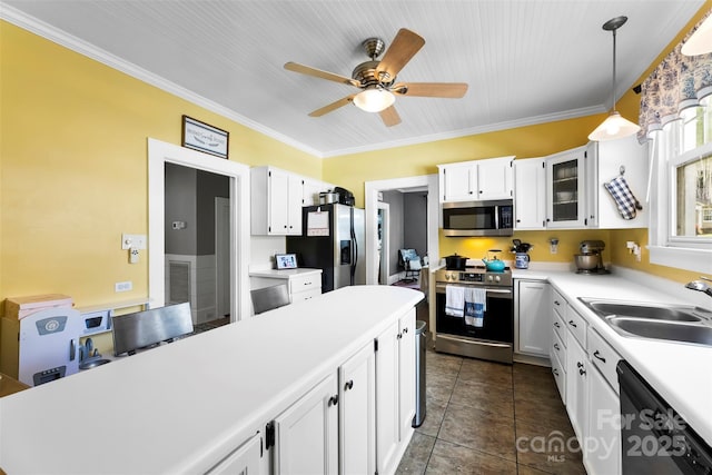 1210 Jackson Rd, Gastonia, NC 28052 - kitchen with stainless steel appliances, light countertops, white cabinets, ceiling fan, and crown molding