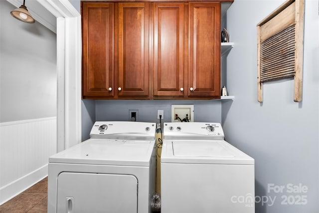 1210 Jackson Rd, Gastonia, NC 28052 - washroom featuring separate washer and dryer, cabinet space, a wainscoted wall, and tile patterned floors