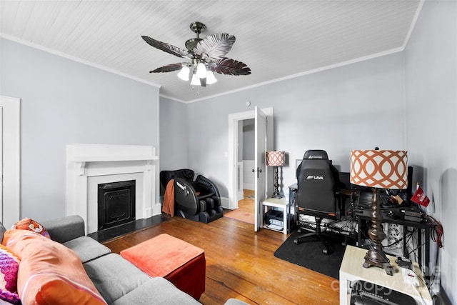 1210 Jackson Rd, Gastonia, NC 28052 - living room featuring wood finished floors, a fireplace, a ceiling fan, and ornamental molding
