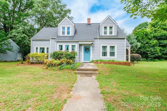 904 Venus St, Kannapolis, NC 28083 - cape cod house featuring a chimney, a front yard, and a shingled roof