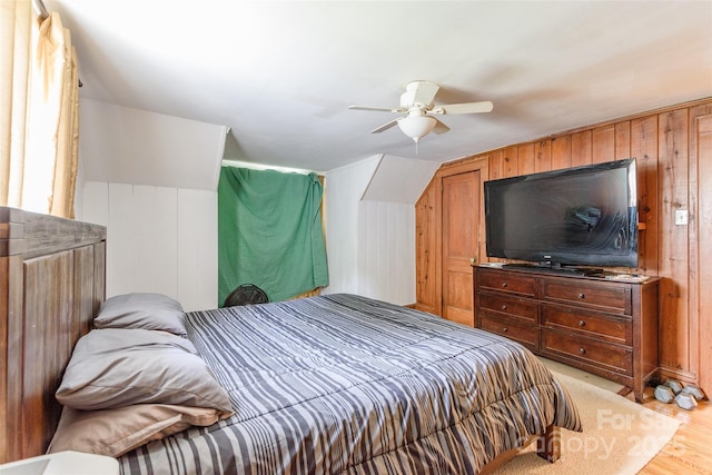 904 Venus St, Kannapolis, NC 28083 - bedroom featuring light wood-style flooring, ceiling fan, and wood walls