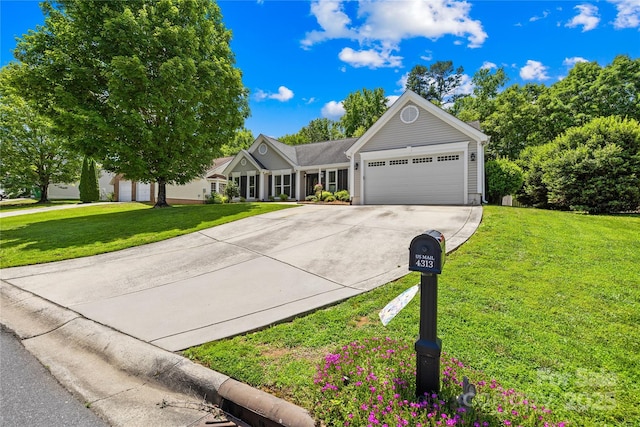 4313 Wynborough Ln, Charlotte, NC 28269 - ranch-style house with a garage, concrete driveway, and a front lawn
