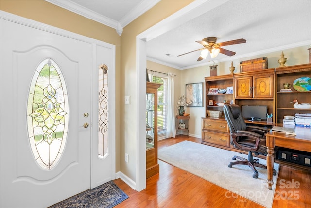 4313 Wynborough Ln, Charlotte, NC 28269 - foyer entrance featuring a ceiling fan, light wood-style flooring, and crown molding