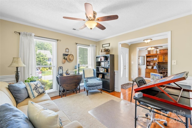 4313 Wynborough Ln, Charlotte, NC 28269 - office featuring wood finished floors, a ceiling fan, a textured ceiling, and ornamental molding