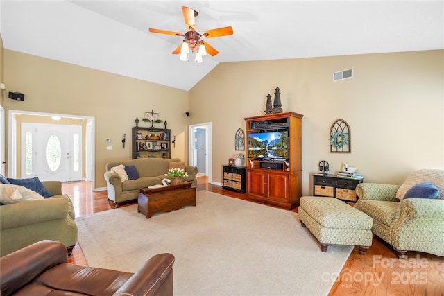 4313 Wynborough Ln, Charlotte, NC 28269 - living area featuring a ceiling fan, wood finished floors, and high vaulted ceiling