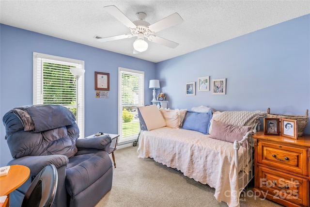 4313 Wynborough Ln, Charlotte, NC 28269 - bedroom with carpet floors, multiple windows, a ceiling fan, and a textured ceiling
