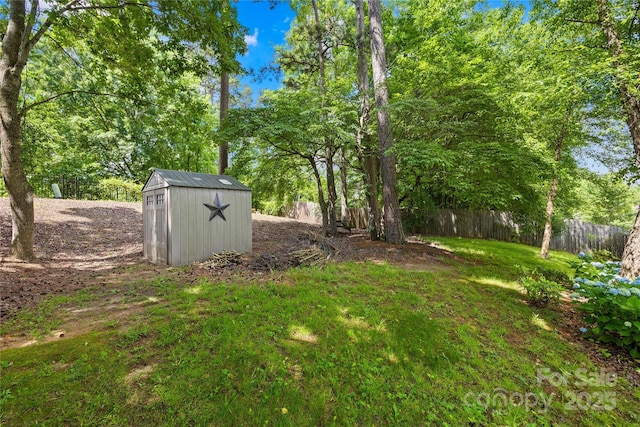 4313 Wynborough Ln, Charlotte, NC 28269 - fenced backyard featuring a storage unit