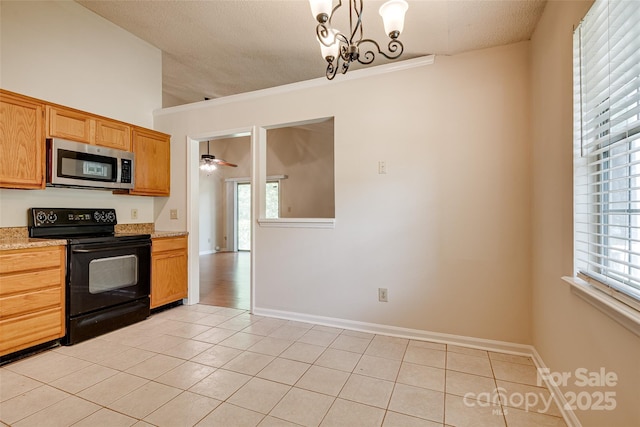 1801 Teddington Dr, Charlotte, NC 28214 - kitchen with stainless steel microwave, black / electric stove, light tile patterned floors, a ceiling fan, and a textured ceiling