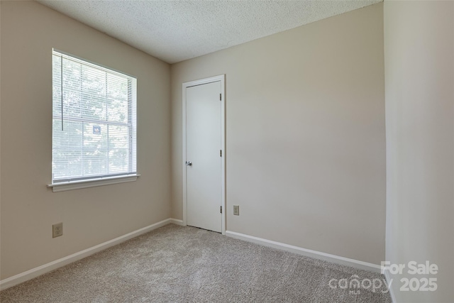 1801 Teddington Dr, Charlotte, NC 28214 - empty room with light colored carpet and a textured ceiling