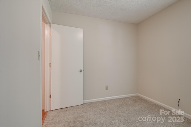 1801 Teddington Dr, Charlotte, NC 28214 - carpeted empty room with a textured ceiling