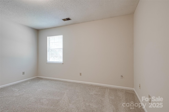 1801 Teddington Dr, Charlotte, NC 28214 - carpeted empty room featuring a textured ceiling and baseboards