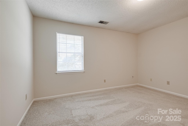 1801 Teddington Dr, Charlotte, NC 28214 - carpeted empty room with a textured ceiling