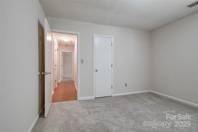 1801 Teddington Dr, Charlotte, NC 28214 - unfurnished bedroom with carpet flooring and a textured ceiling