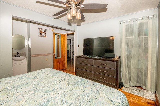 47 Campground Rd, Asheville, NC 28805 - bedroom featuring wood finished floors, ornamental molding, ceiling fan, and a textured ceiling
