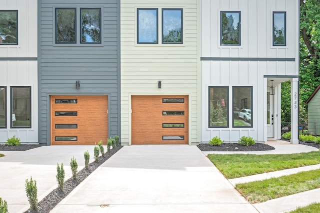 2733 Cowles Rd, Charlotte, NC 28208 - view of front of property with board and batten siding, concrete driveway, and an attached garage