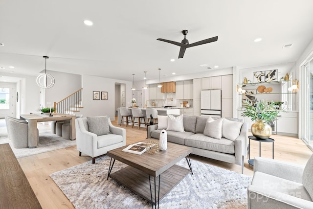 2733 Cowles Rd, Charlotte, NC 28208 - living area with stairway, light wood-style floors, recessed lighting, and a ceiling fan