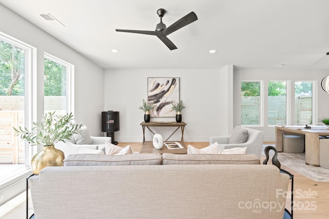 2733 Cowles Rd, Charlotte, NC 28208 - living room with healthy amount of natural light, a ceiling fan, wood finished floors, and recessed lighting