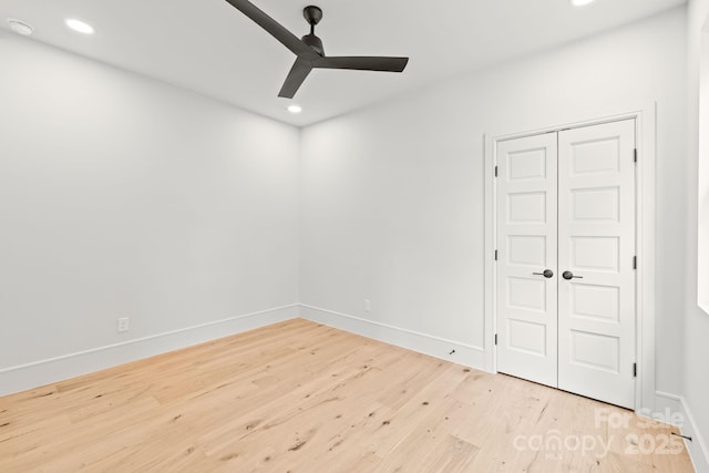 2733 Cowles Rd, Charlotte, NC 28208 - unfurnished bedroom featuring wood finished floors, recessed lighting, a closet, and a ceiling fan
