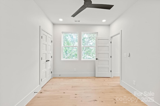 2733 Cowles Rd, Charlotte, NC 28208 - unfurnished bedroom with wood finished floors, recessed lighting, and ceiling fan