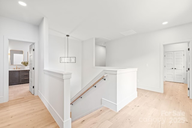 2733 Cowles Rd, Charlotte, NC 28208 - corridor featuring an upstairs landing, light wood-style floors, and recessed lighting