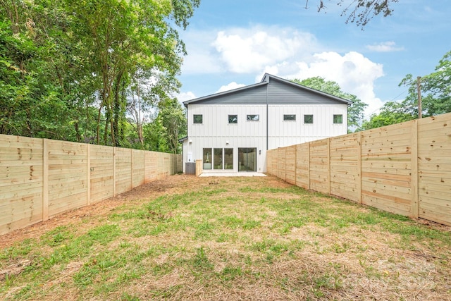 2733 Cowles Rd, Charlotte, NC 28208 - back of house with board and batten siding and a fenced backyard