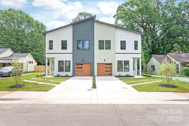 2733 Cowles Rd, Charlotte, NC 28208 - contemporary house with board and batten siding, a garage, and concrete driveway