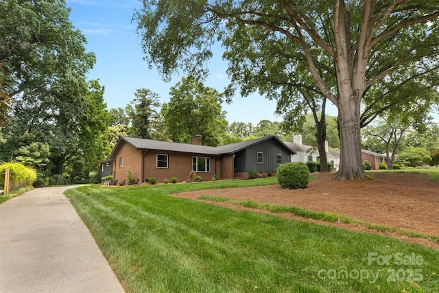 3701 Table Rock Rd, Charlotte, NC 28226 - ranch-style house featuring a chimney, brick siding, concrete driveway, and a front yard