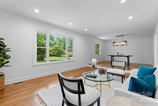 3701 Table Rock Rd, Charlotte, NC 28226 - living area with a chandelier, light wood finished floors, and recessed lighting