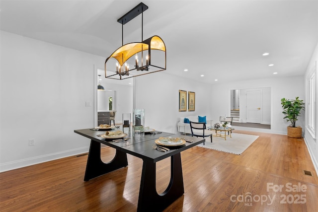 3701 Table Rock Rd, Charlotte, NC 28226 - dining area with wood finished floors, recessed lighting, and a chandelier