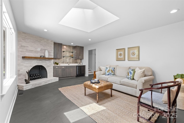 3701 Table Rock Rd, Charlotte, NC 28226 - living area featuring bar, wine cooler, a skylight, and recessed lighting
