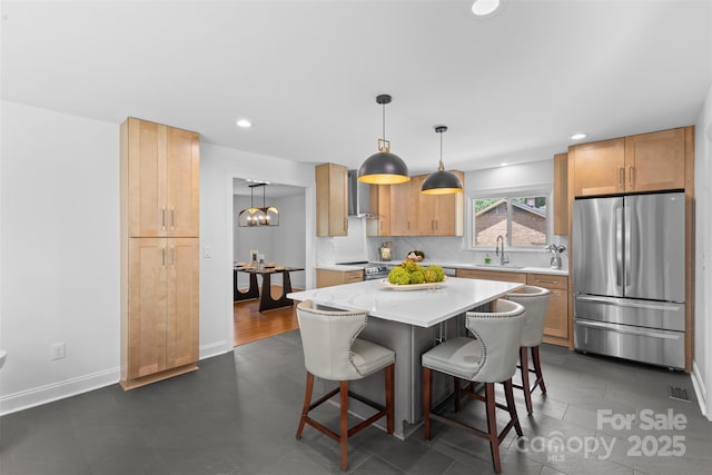 3701 Table Rock Rd, Charlotte, NC 28226 - kitchen with appliances with stainless steel finishes, a kitchen breakfast bar, wall chimney range hood, recessed lighting, and backsplash