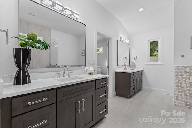 3701 Table Rock Rd, Charlotte, NC 28226 - bathroom with lofted ceiling, two vanities, and healthy amount of natural light